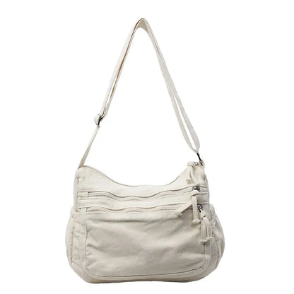 👜✨Veľkokapacitná taška cez rameno z ošúchaného plátna: dizajn s viacerými priehradkami na zips a širokým nastaviteľným ramenným popruhom.