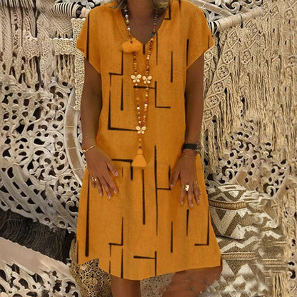 👗【Sezonsko znižanje】【S–5XL】Ženska bombažna obleka z V-izrezom – udobna in elegantna – Znižana cena