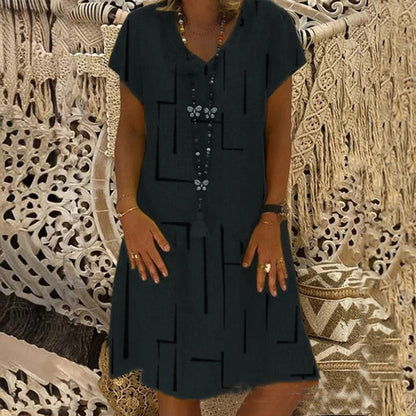 👗【Sezonsko znižanje】【S–5XL】Ženska bombažna obleka z V-izrezom – udobna in elegantna – Znižana cena