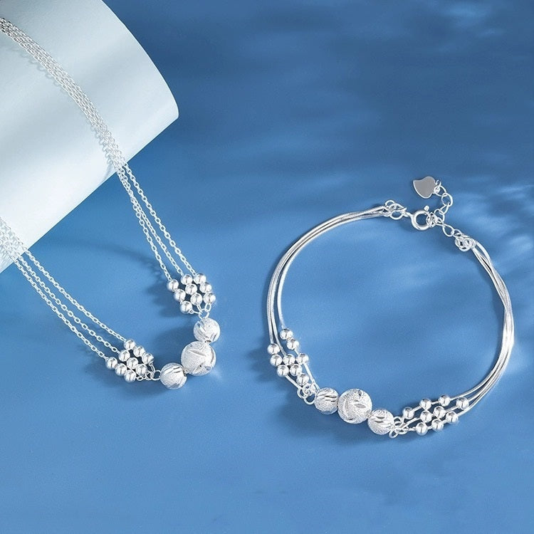 🔥【Kup jeden, a drugi dostaniesz gratis】🔥✨Lekki i luksusowy naszyjnik + bransoletka z koralików przynoszących szczęście