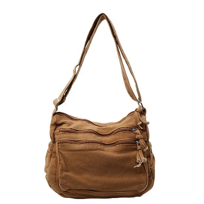 👜✨Veľkokapacitná taška cez rameno z ošúchaného plátna: dizajn s viacerými priehradkami na zips a širokým nastaviteľným ramenným popruhom.